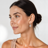A model is wearing 2 carat Asscher Solitaire Drop Diamond Earring