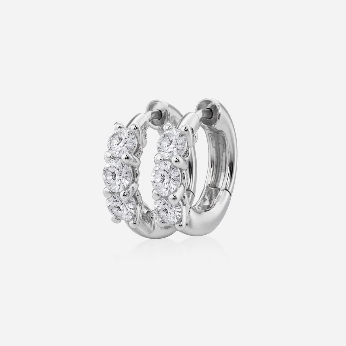 Discover timeless beauty with our Cushion Lab Grown Diamond Huggie Hoop Earrings, showcasing three dazzling lab-grown diamonds per earring. Available in 1, 2, and 3 carat options and crafted in your choice of 14K or 18K gold | Adorn By You