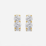 Our Cushion Lab Grown Diamond Huggie Hoop Earrings by Adorn By You, beautifully crafted in radiant yellow gold. Featuring three brilliant lab-grown diamonds per earring and available in 1, 2, and 3 carat options