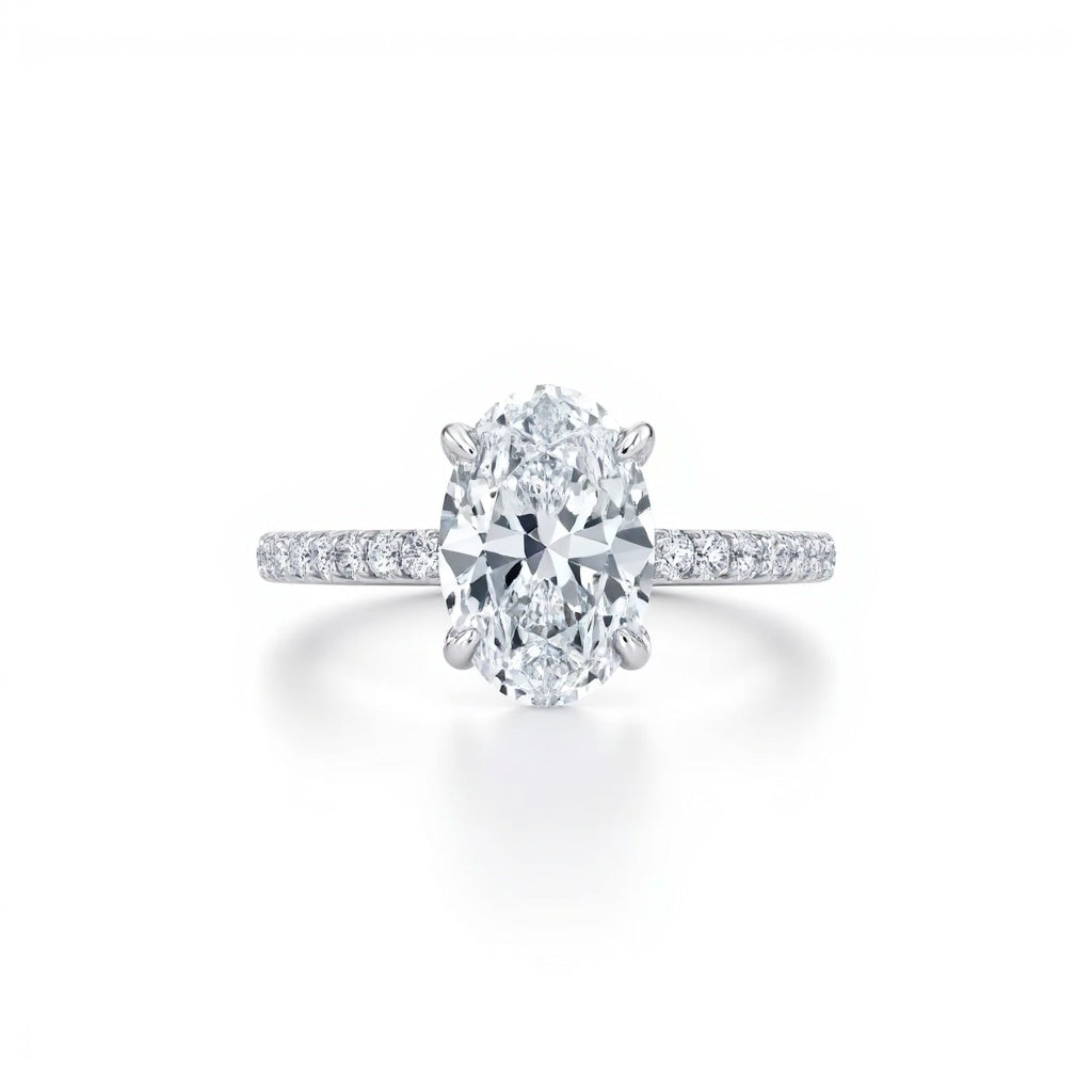 Oval Solitaire Engagement Ring with side Halo and  Pavé Band  | Adorn By You
