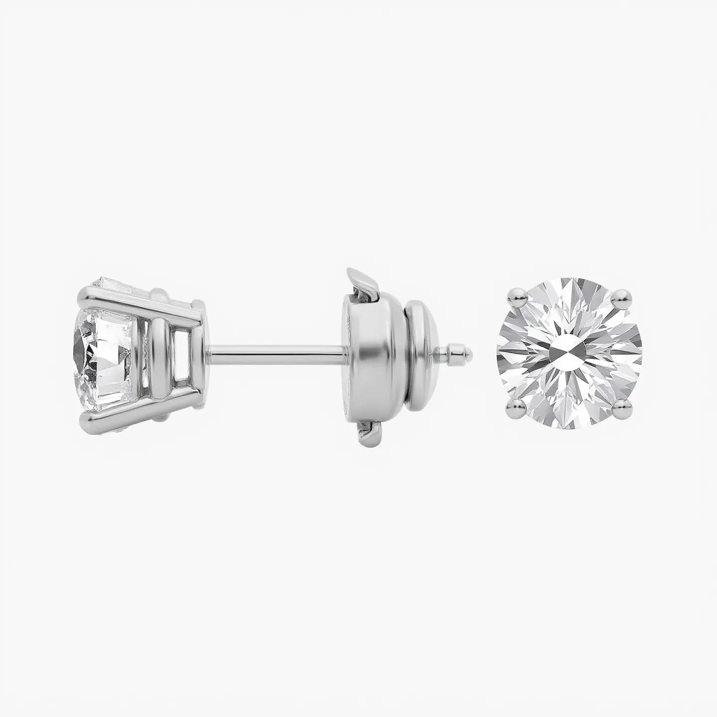 Side view of round lab-grown diamond solitaire studs in 14K/18K gold. Four-prong setting with guardian Back style | Adorn By You