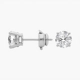 Side view of round lab-grown diamond solitaire studs in 14K/18K gold. Four-prong setting with guardian Back style | Adorn By You