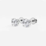Lab-grown round diamond solitaire studs in 14K/18K gold. VS clarity, 0.25–6 CTW, four-prong, screw-back | Adorn By You