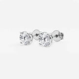 Lab-grown round diamond solitaire studs in 14K/18K gold. VS clarity, 0.25–6 CTW, four-prong, screw-back | Adorn By You