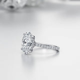 The Celestial Grace - Oval Solitaire with side Halo and  Pavé Band. This is the classic ring for a perfect engagement or proposal occasion.  | Adorn By You